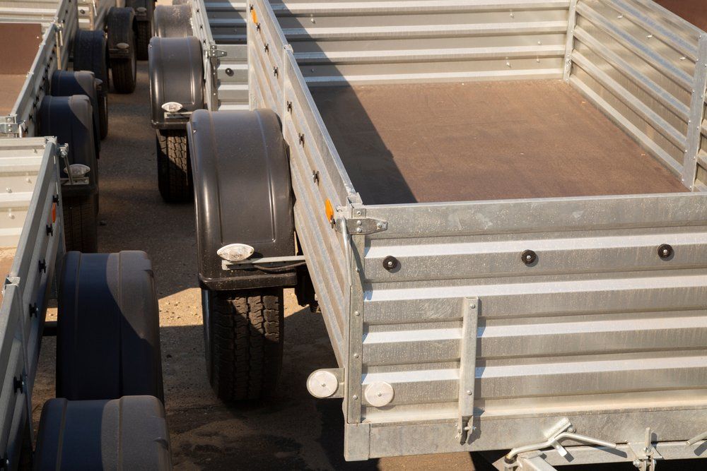 A Row of Trailers Are Parked Next to Each Other in A Warehouse — North Coast Steel in Crescent Head, NSW