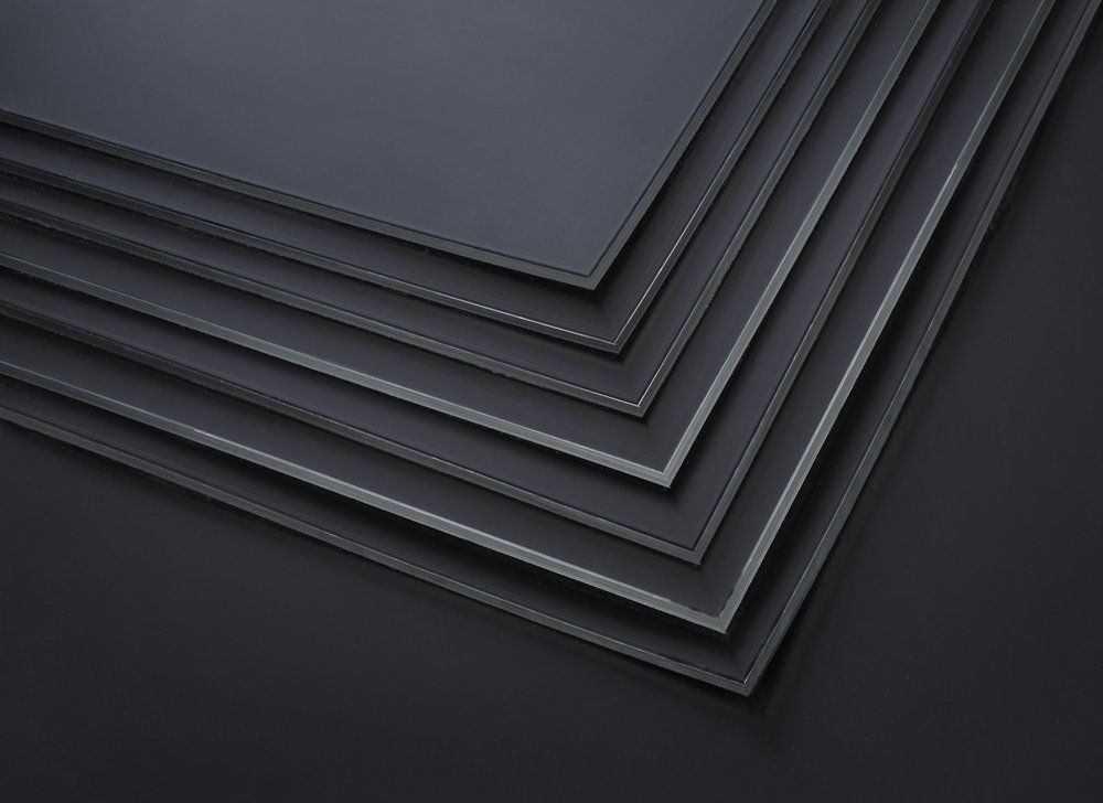 A Stack of Black Sheets of Plastic Are Stacked on Top of Each Other on A Black — North Coast Steel in South West Rocks, NSW