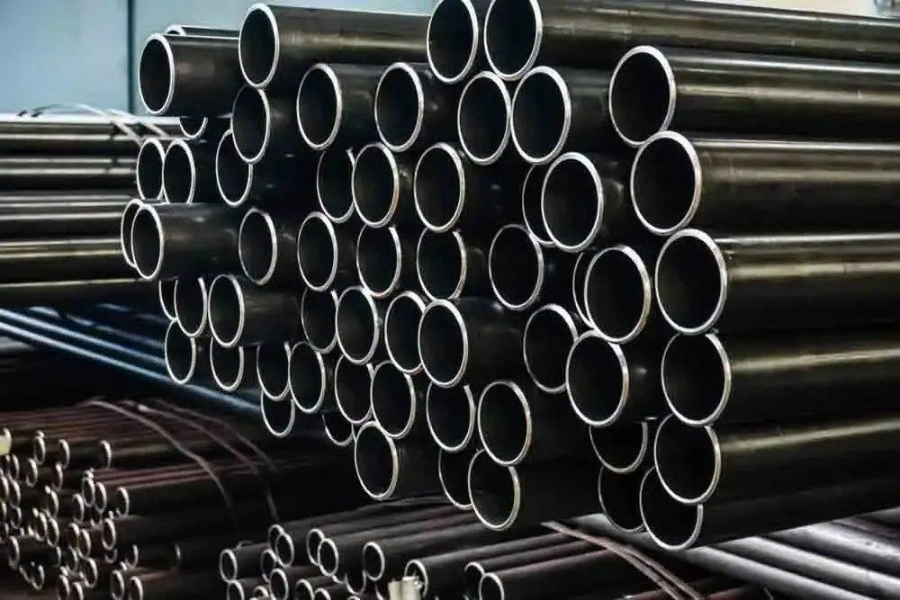 A Bunch of Metal Pipes Stacked on Top of Each Other — North Coast Steel in Macksville, NSW