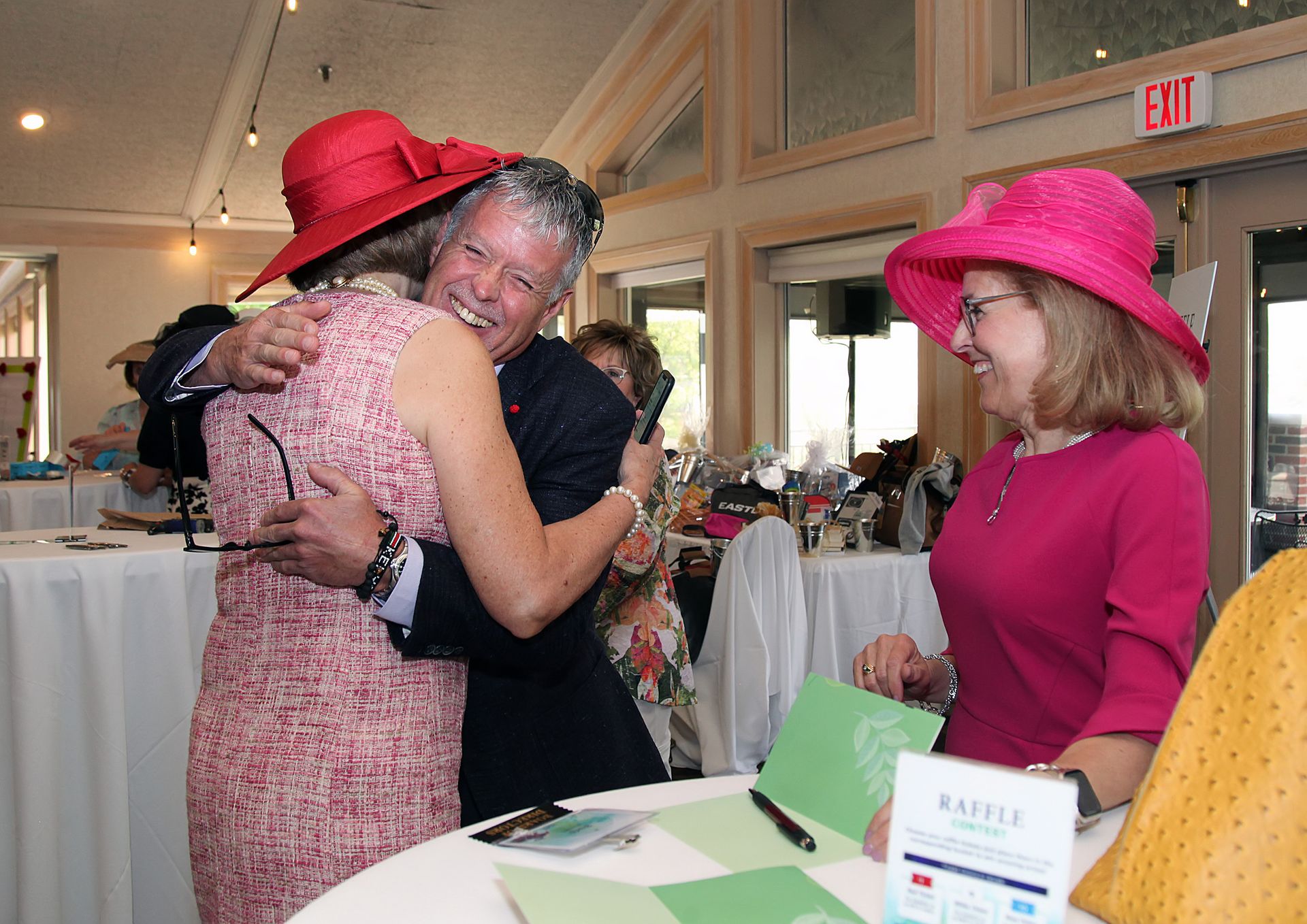 A man and a woman are hugging each other in a room.