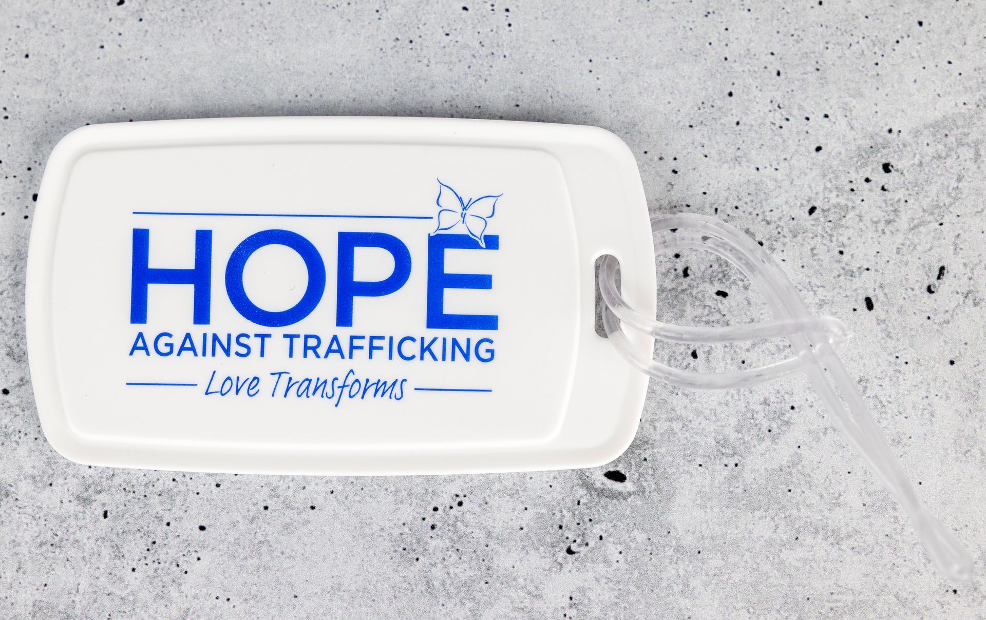 White tray with blue “HOPE Against Trafficking” text on a gray background