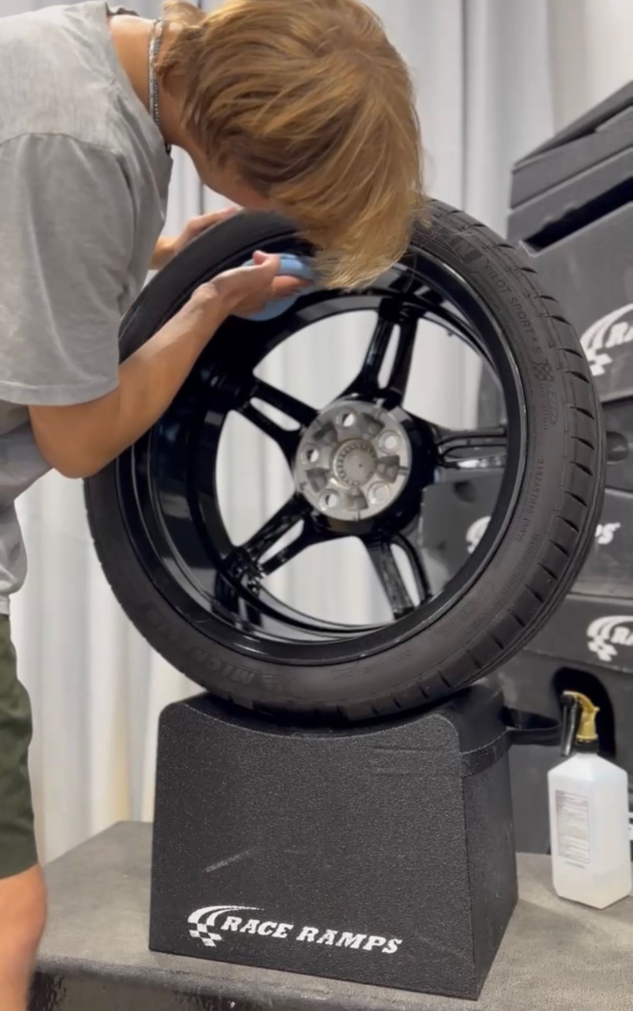 a man is adjusting a tire on a race ramp