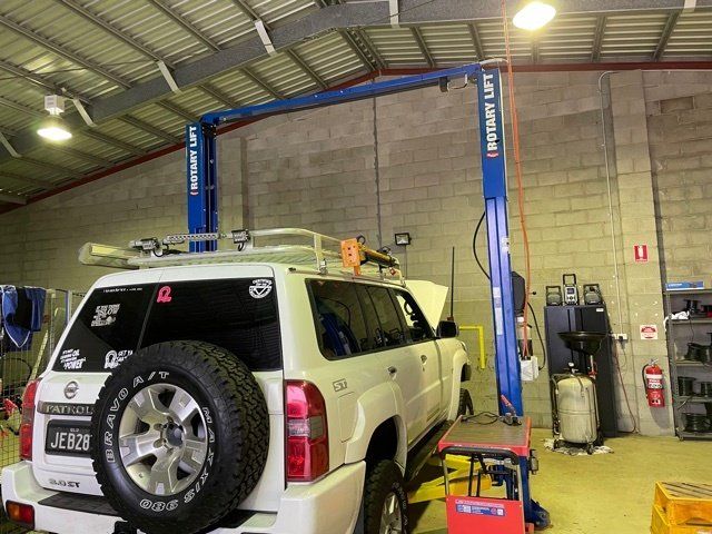 Truck on Hoist at Mechanic's Workshop — Dyna Automotive in Paget, QLD