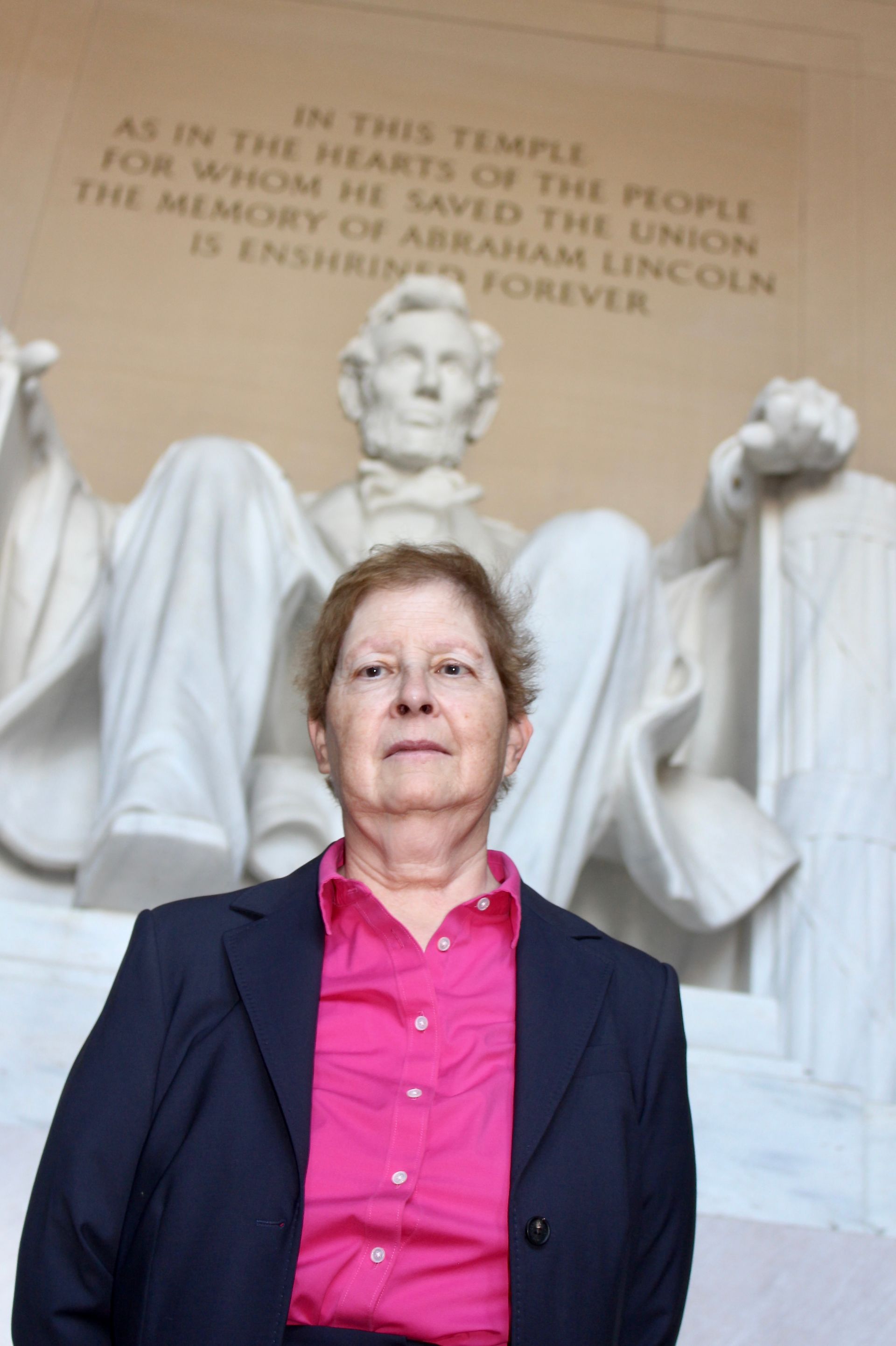Dr. Leslie Gruis standing in front of Lincoln Memorial