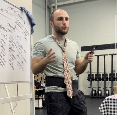 Coach Nick giving a presentation of financial fitness