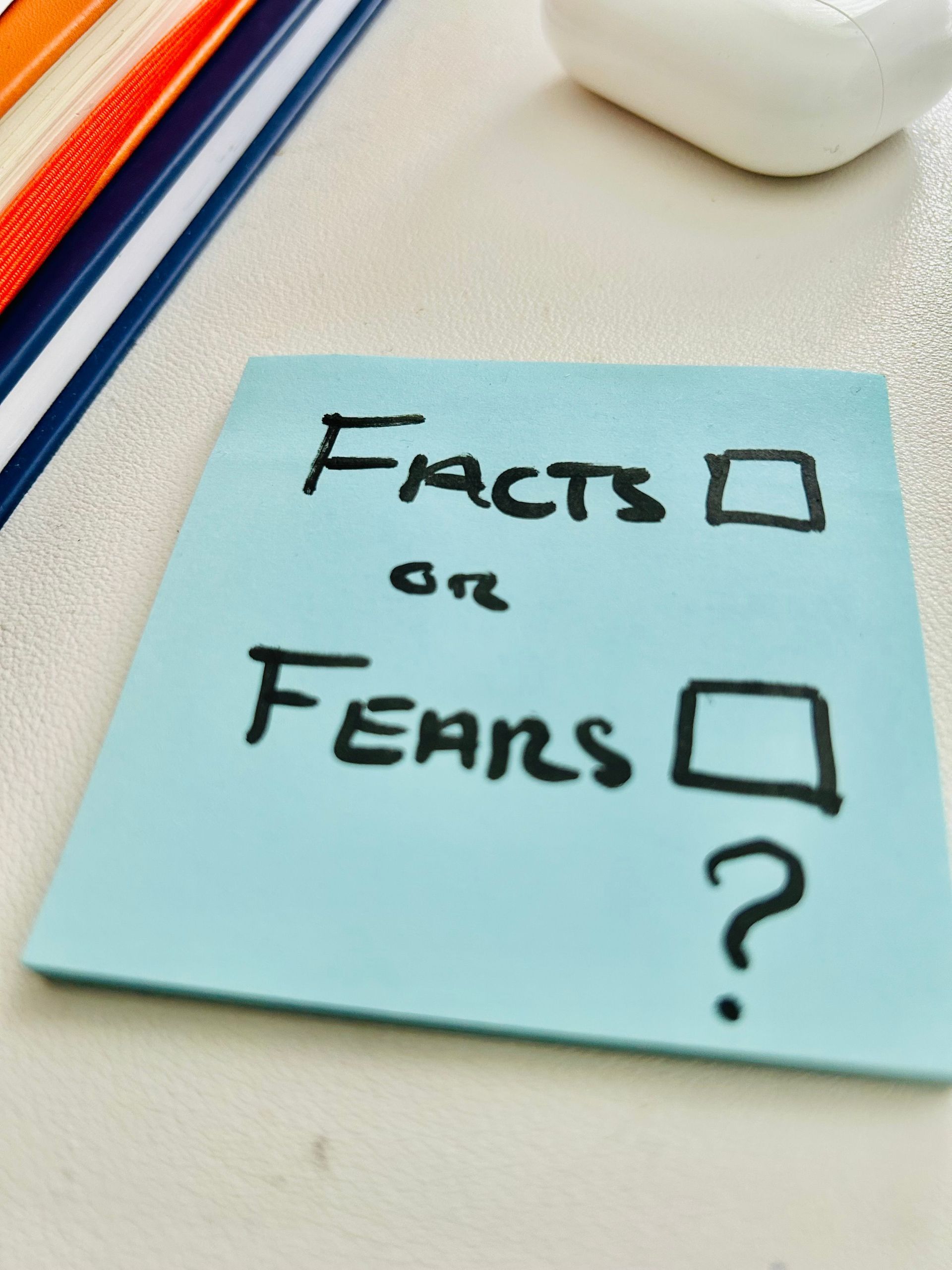 Post-it note with fact or fears, asking which box should ou pick.