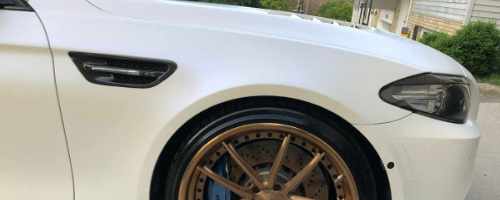 detailed front end of a white BMW