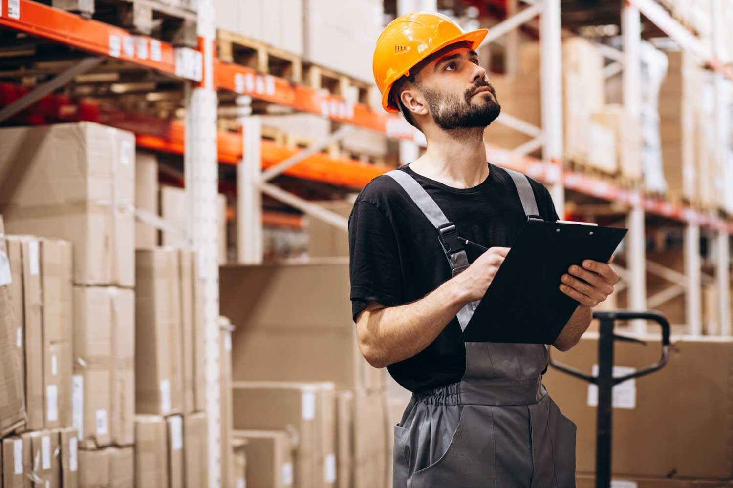 Warehouse worker wearing an orange hard hat