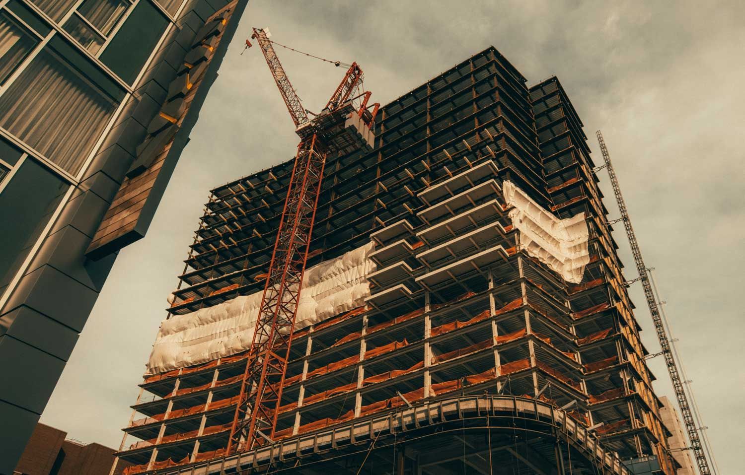 Construction site with a tall building under construction