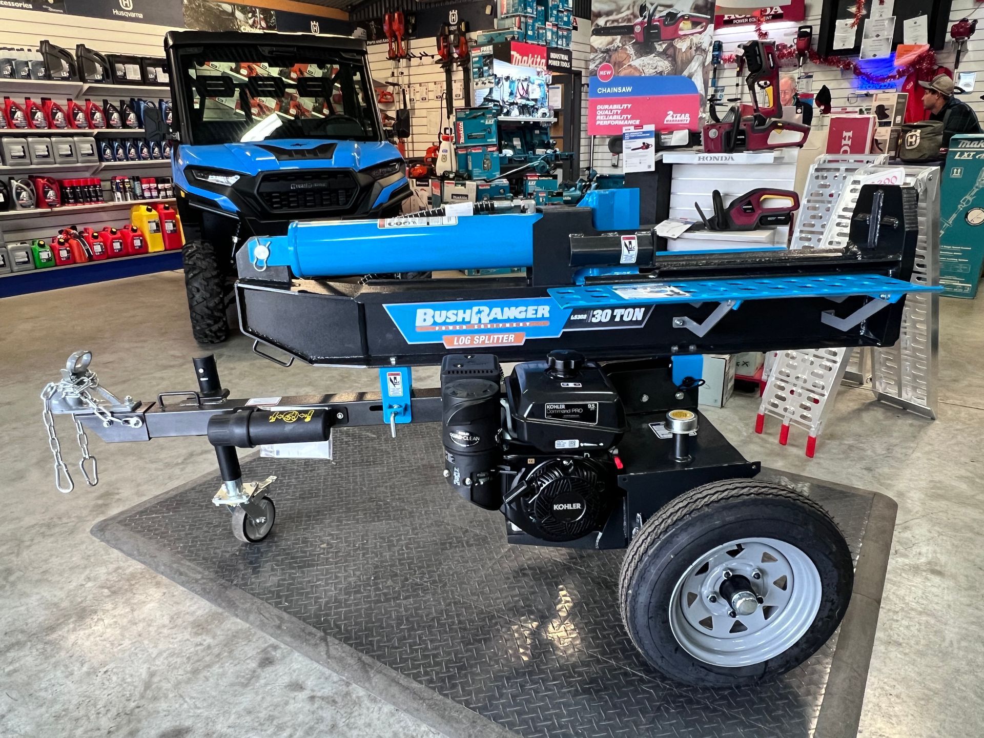 A Blue and Black 30-ton Log Splitter on a Trailer — Gloucester Outdoor Solutions In Gloucester, NSW