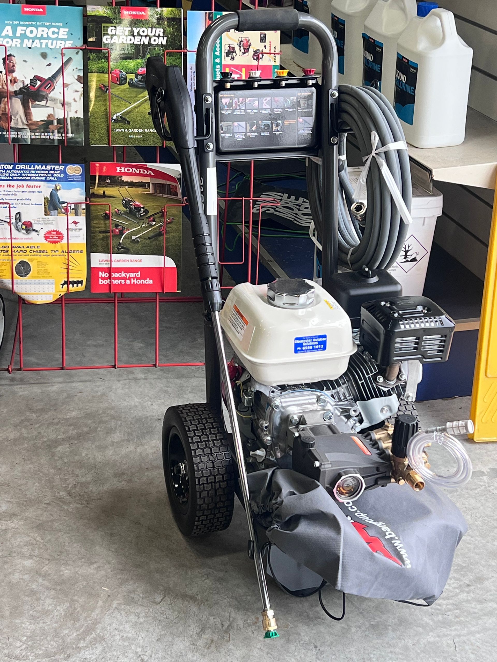 Pressure Washer With a Honda Engine, Standing on a Gray Floor in a Store — Gloucester Outdoor Solutions In Gloucester, NSW