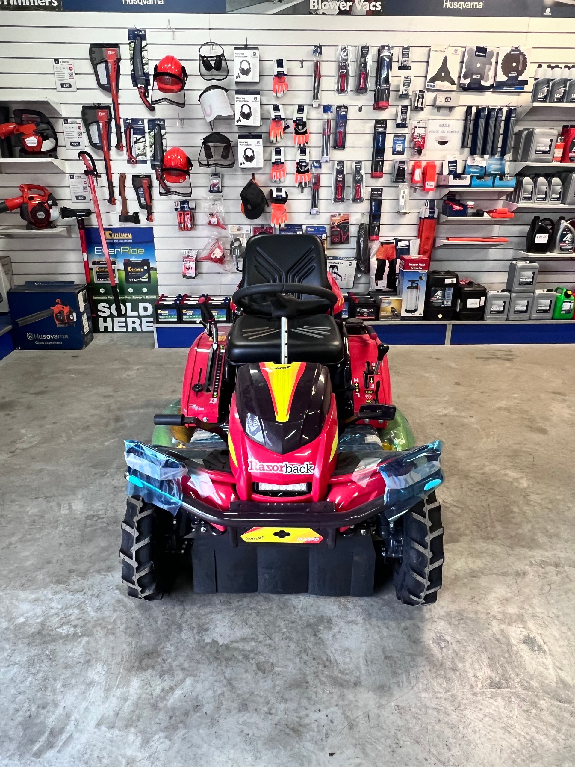 Red Riding Lawn Mower in a Store — Gloucester Outdoor Solutions In Gloucester, NSW