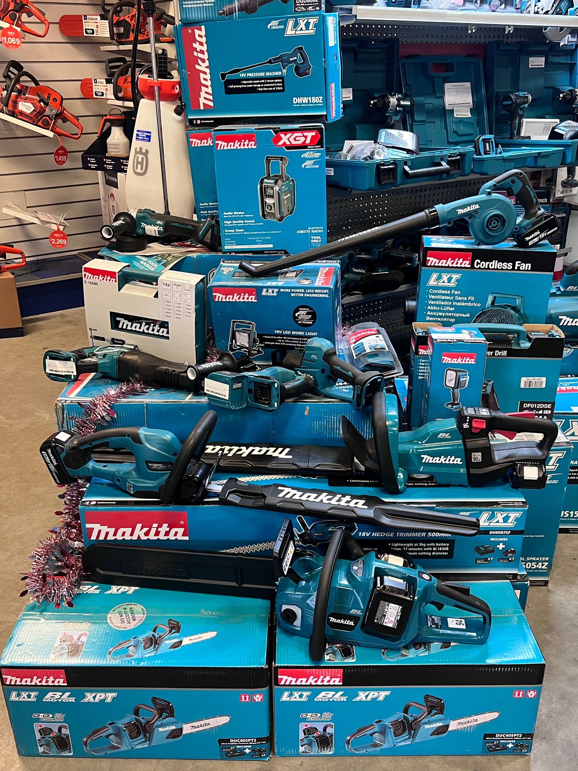 A Display of New Makita Power Tools in Teal Boxes and Tools — Gloucester Outdoor Solutions In Gloucester, NSW