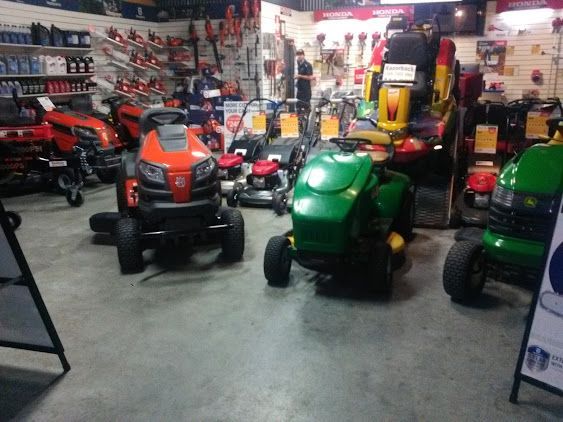 Orange And Green Lawn Mowers — Gloucester Outdoor Solutions In Gloucester, NSW