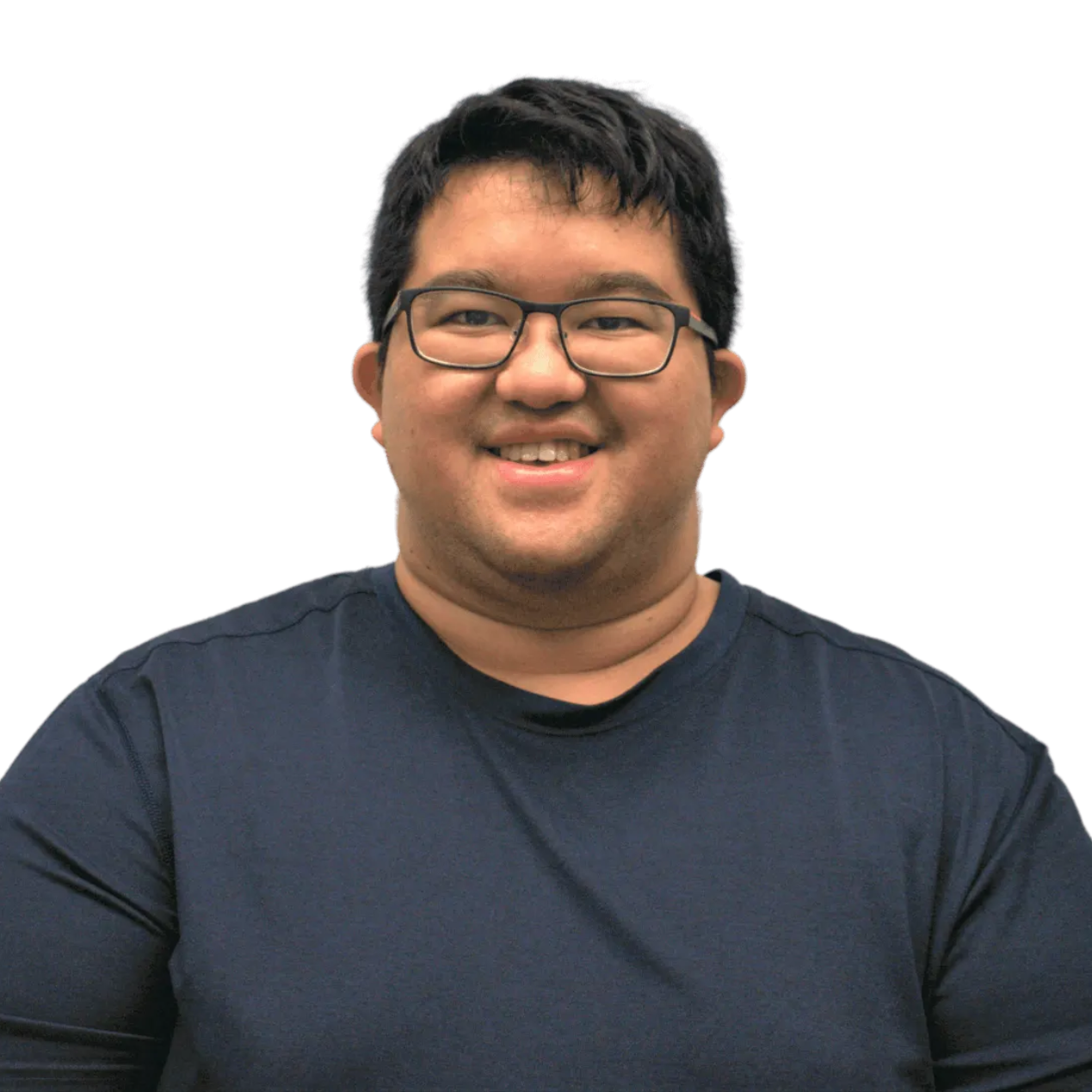 A man wearing glasses and a blue shirt smiles for the camera