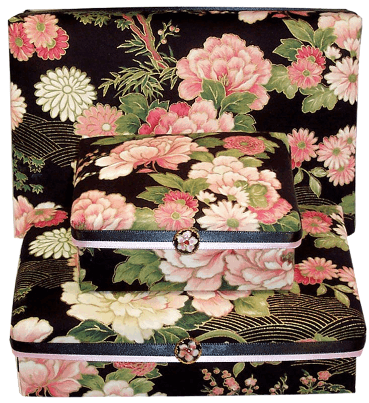 Three boxes with flowers on them are stacked on top of each other