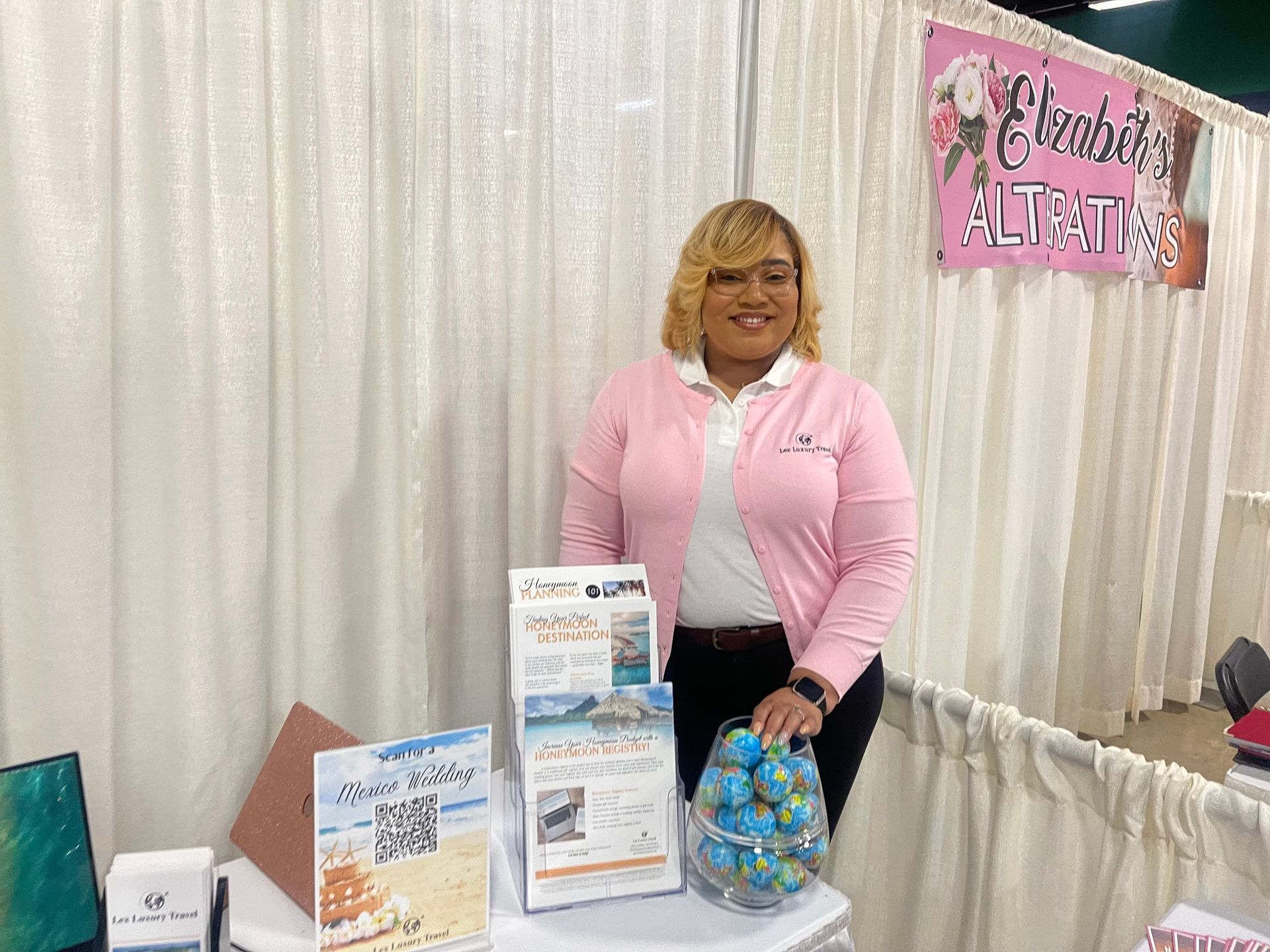 Lex Luxury Travel team member representing travel services at a community event
