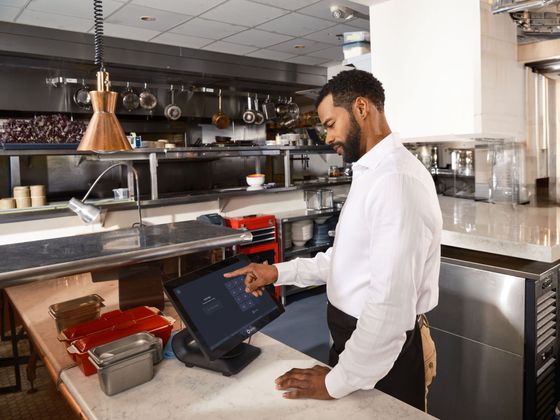 Restaurant operator reviewing kitchen operations