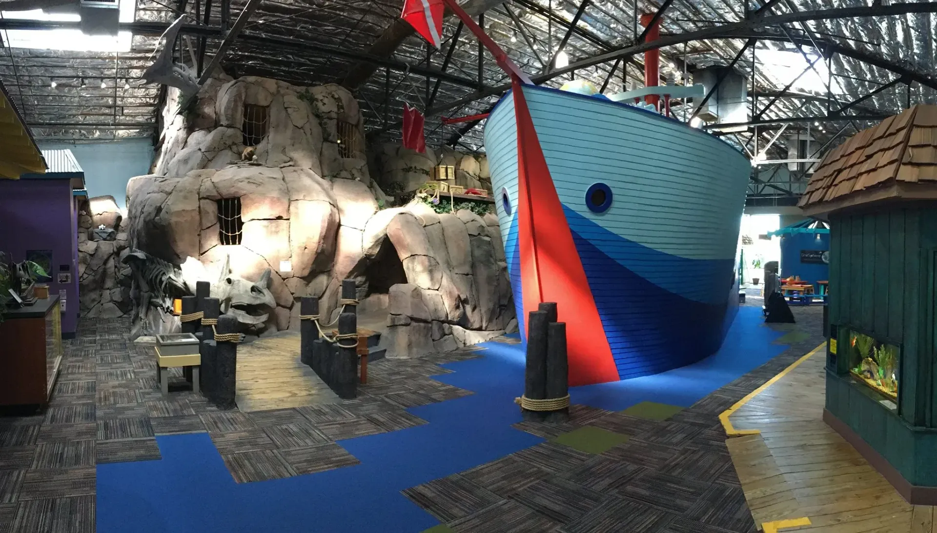 A large boat is in the middle of a room