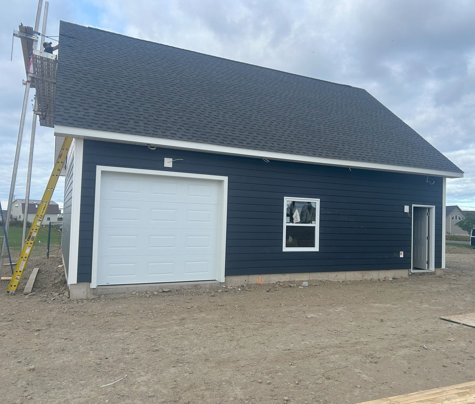 framing and siding of house  and garage