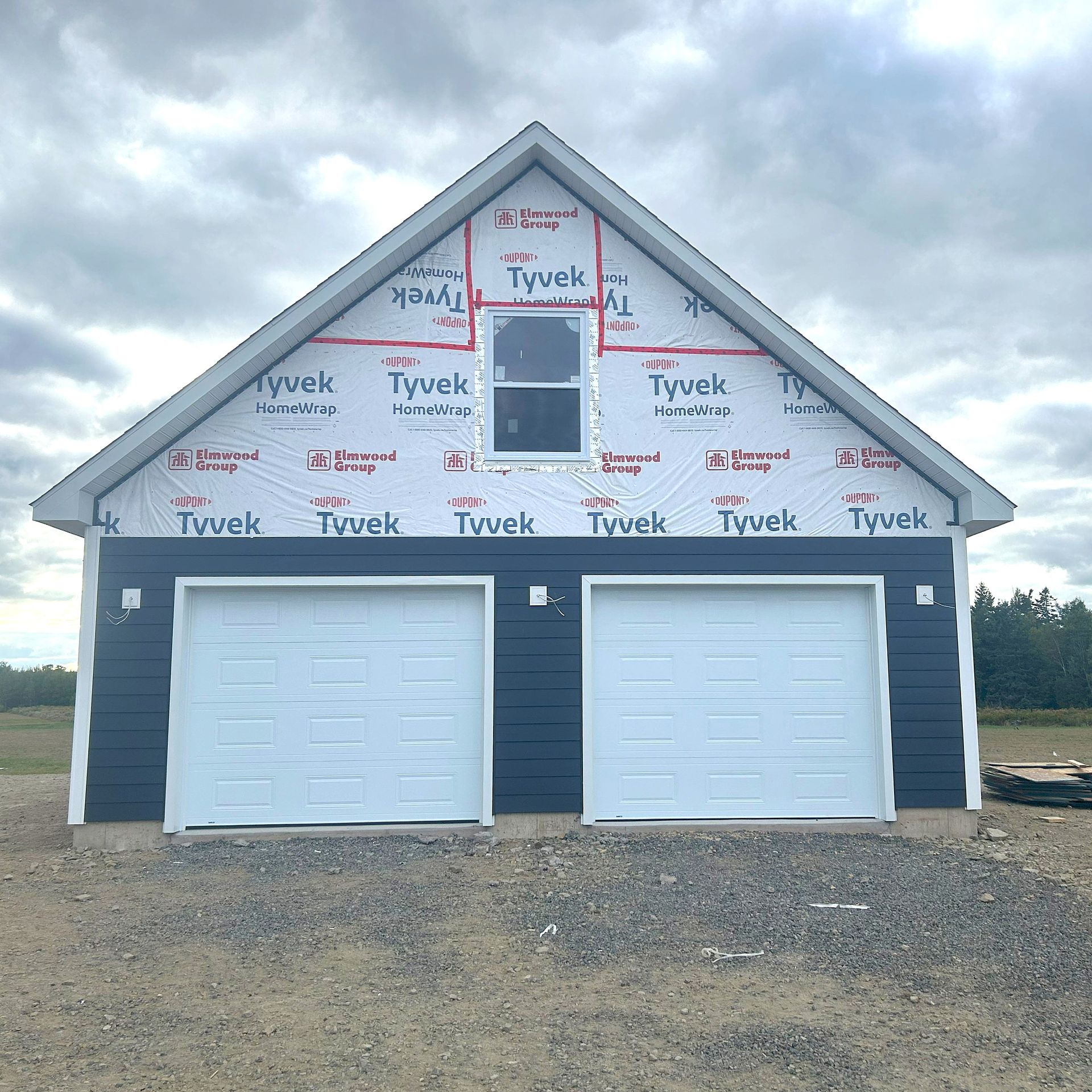framing and siding of house  and garage