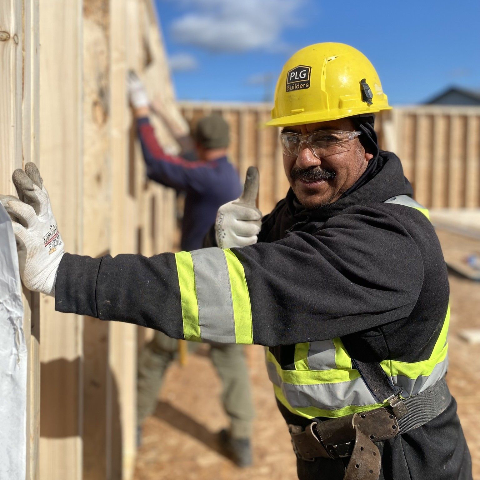 happy crew member doing framing