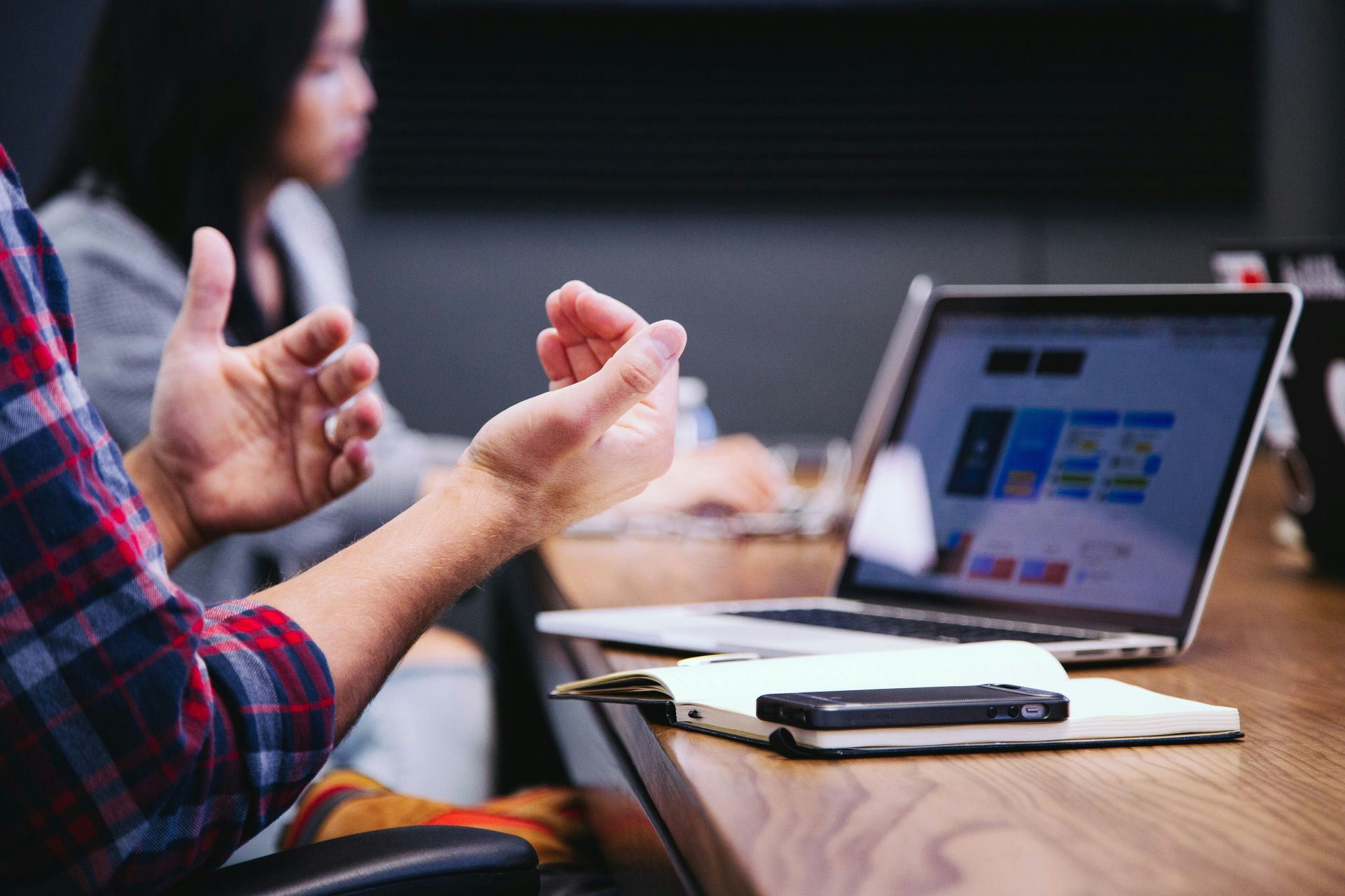 A group of people are walking through a lush green forest