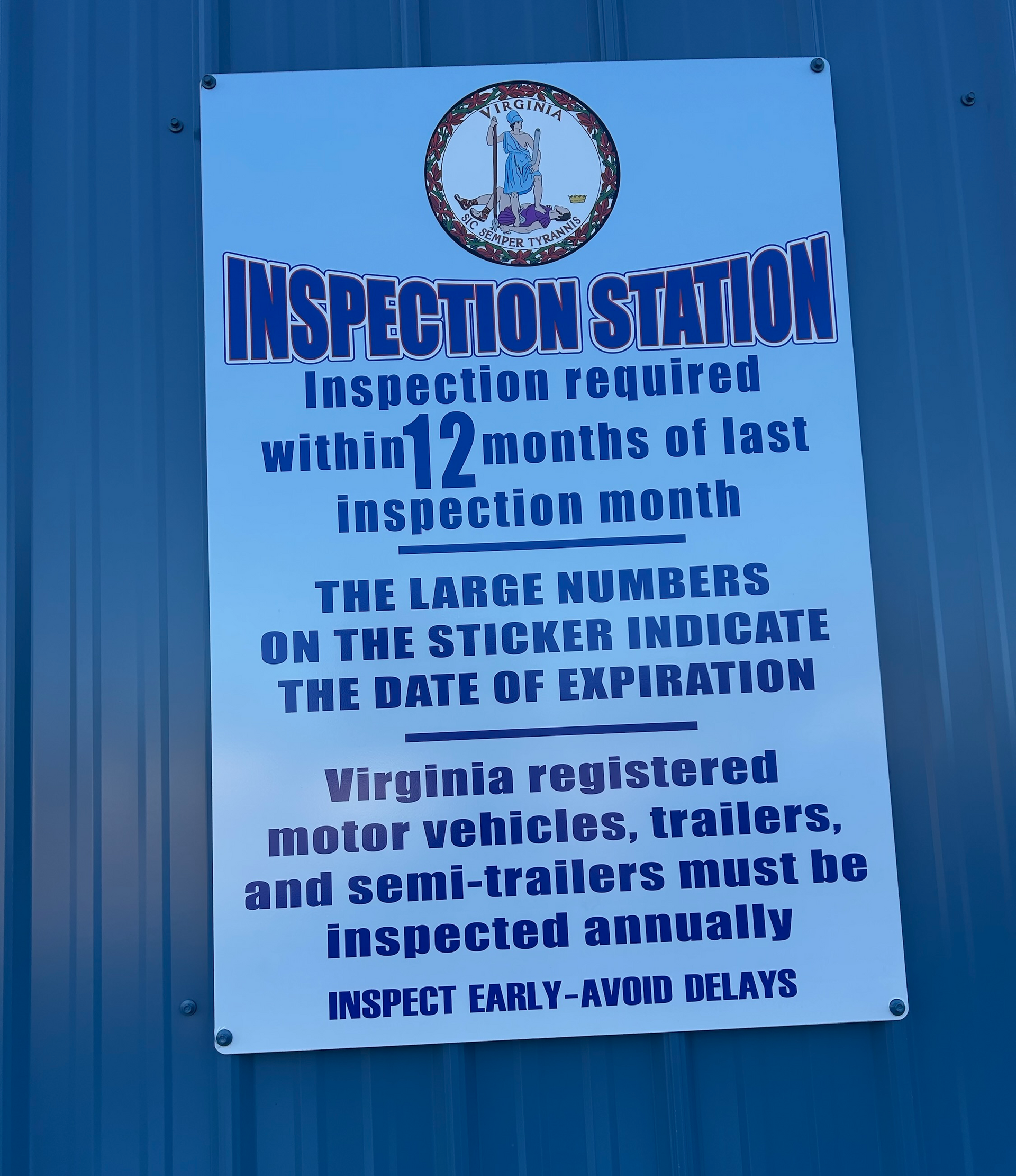 Sign: Virginia inspection station information, white and blue, with state seal | Chip Ragans Auto, LLC