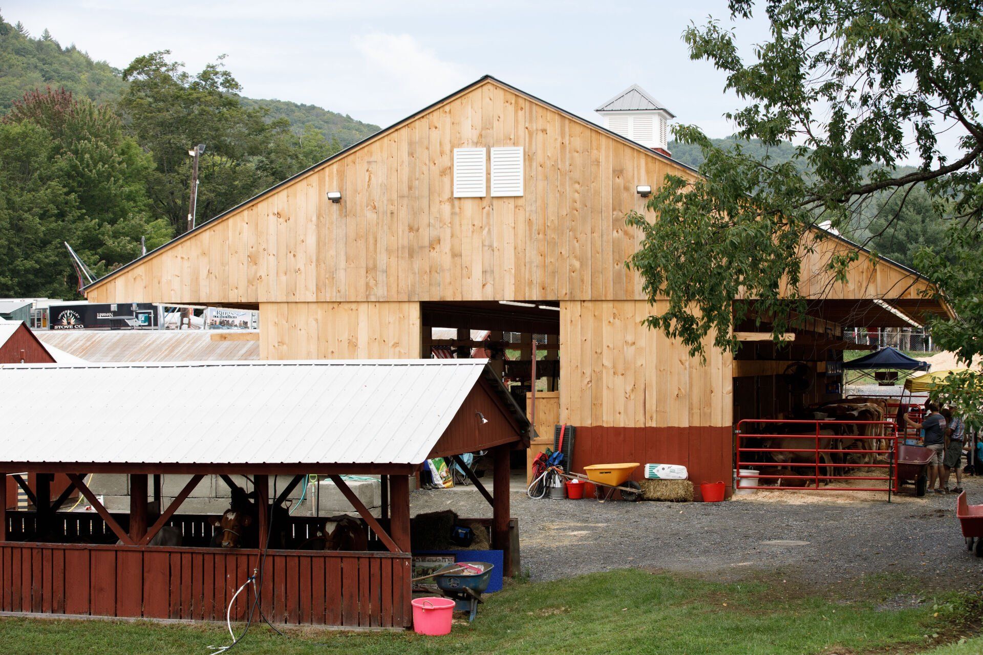 A large wooden barn with a white roof