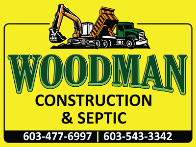 Woodman Construction & Septic sign with excavator, dump truck, and phone numbers on yellow background