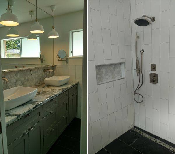 Bathroom vanity and tiled shower with dark green cabinetry, marble countertop, and glass pendant lights