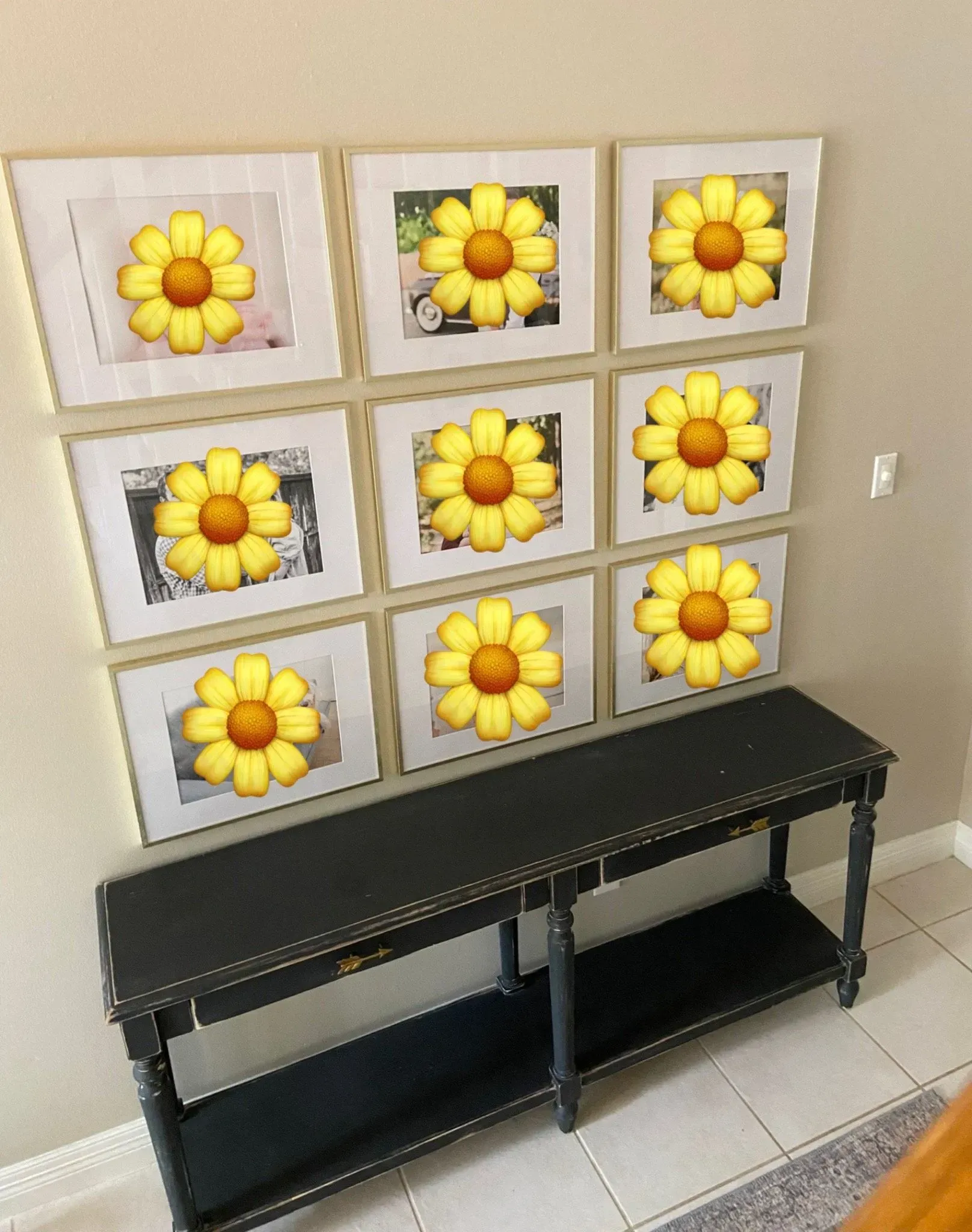 Wall-mounted flower canvas art above a black bench in a beige entryway