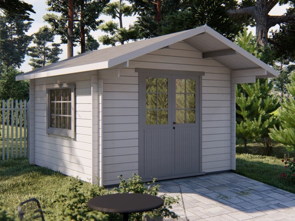 Small white garden shed with gray doors, window, and a sloped roof on a grassy yard with a paved path.