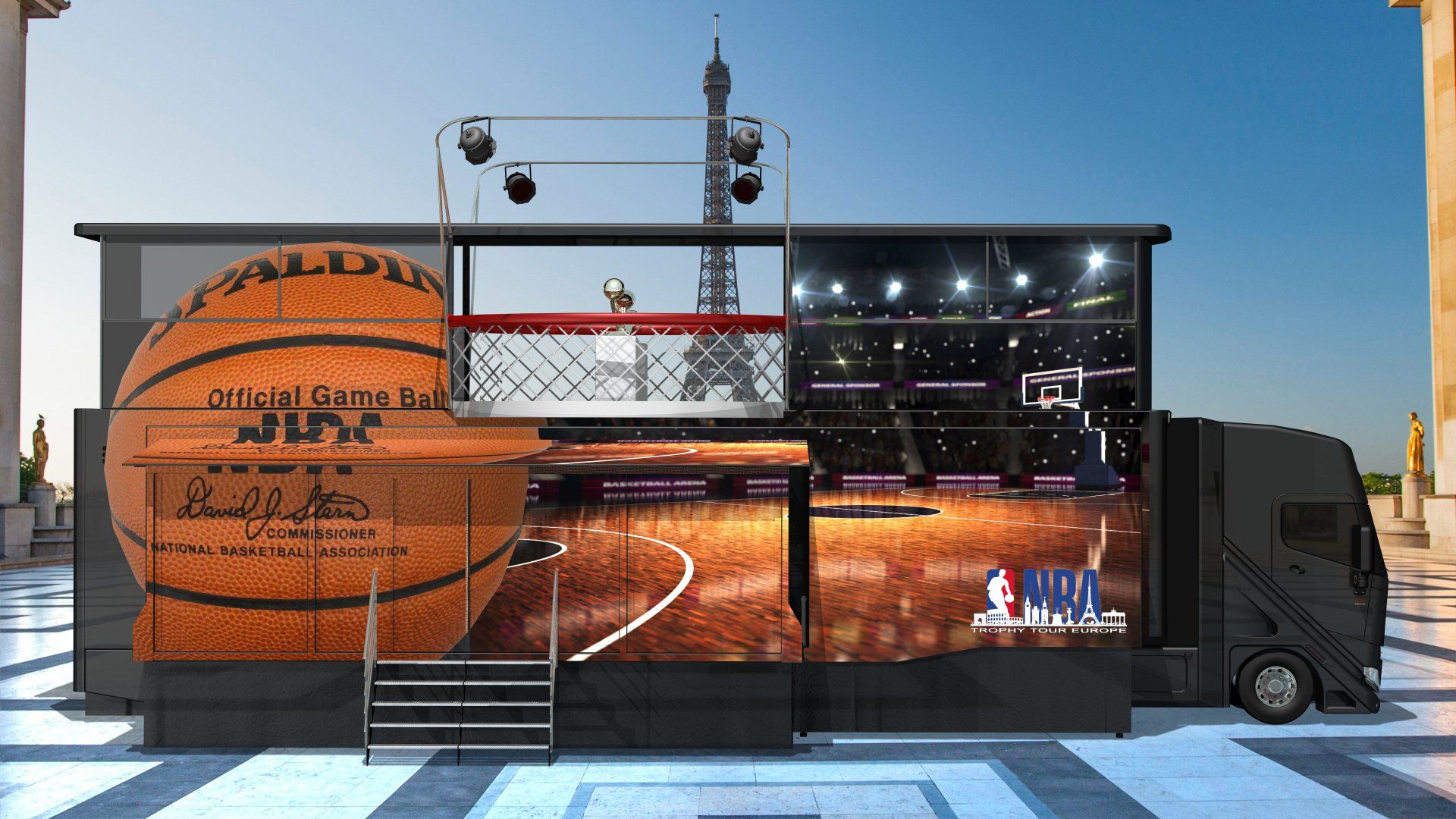 Mobile basketball court trailer with large orange basketball graphic and hoop under stadium lights
