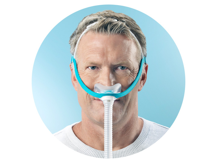 A man is wearing an oxygen mask on his nose A man is wearing an oxygen mask on his nose