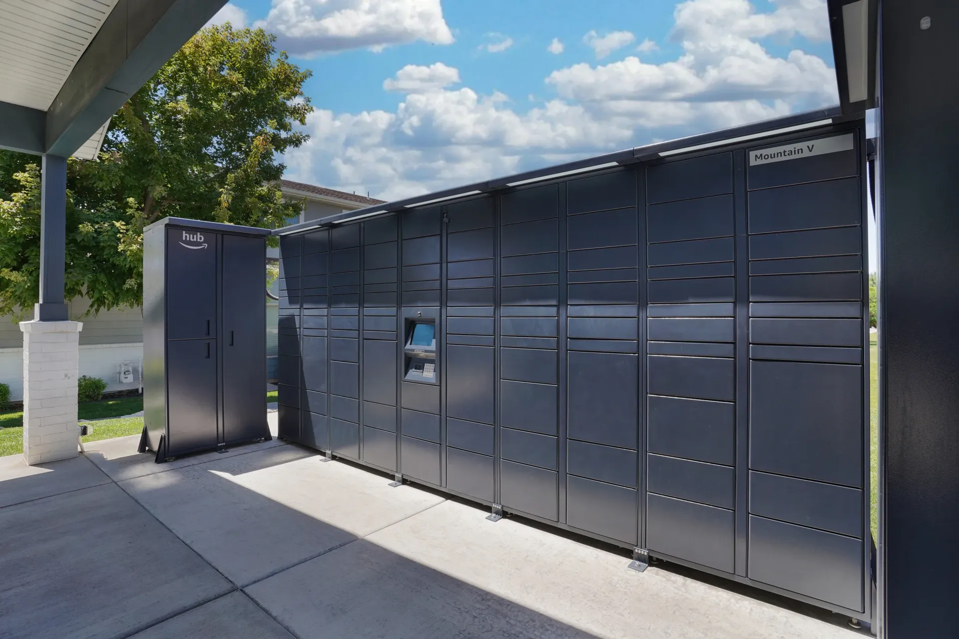 Amazon Hub locker system and Mountain V package lockers at Mountain View Townhomes, offering townhomes in Ogden, UT.