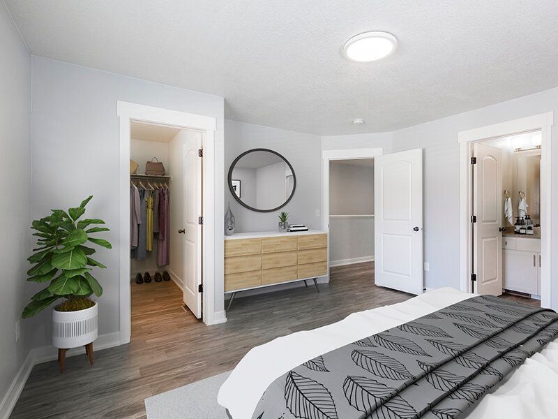 Mountain View Townhomes with a dresser, round mirror, and open closet.