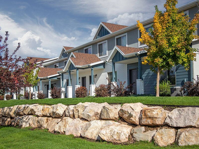 Mountain View Townhomes buildings with gabled roofs and landscaped front yards.