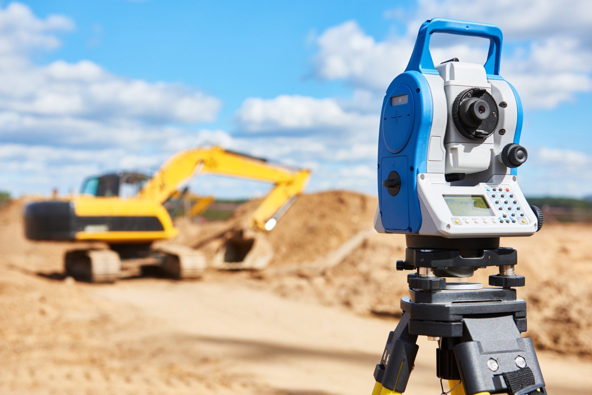 Surveyor Equipment at a Construction Site With Excavator — Ashland, OR — Polaris Land Surveying LLC