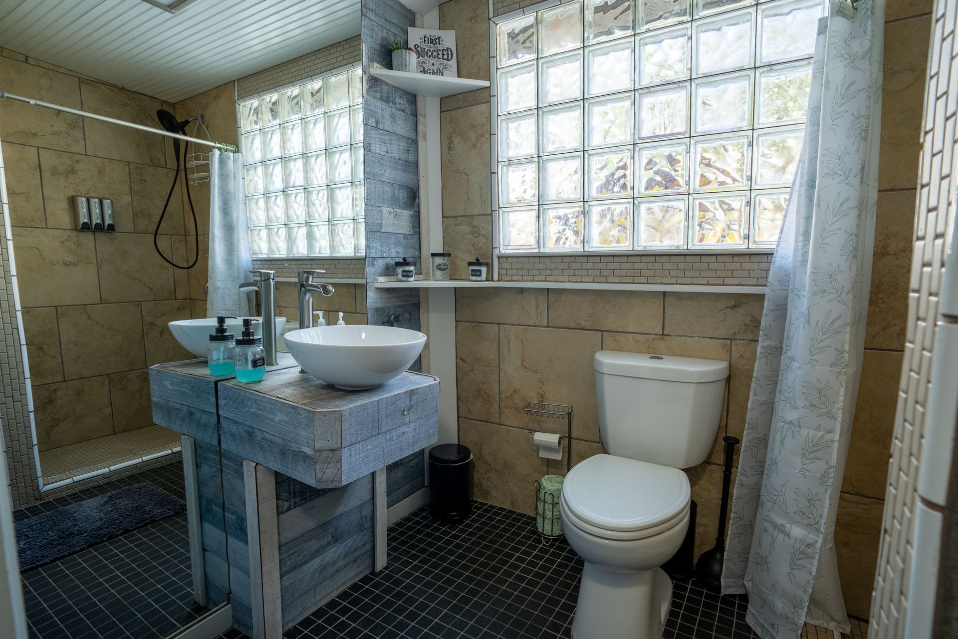 Guest bathroom with walk-in shower, vessel sink and glass block window