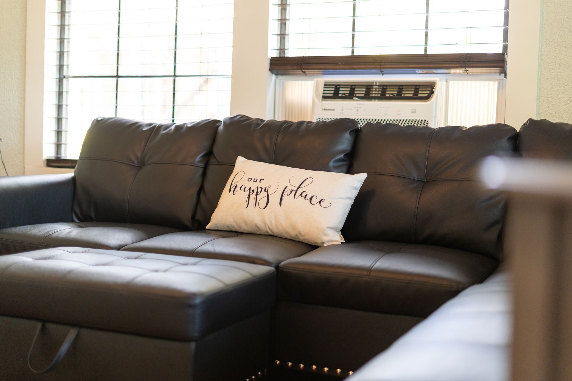 Black leather sectional sofa with a 