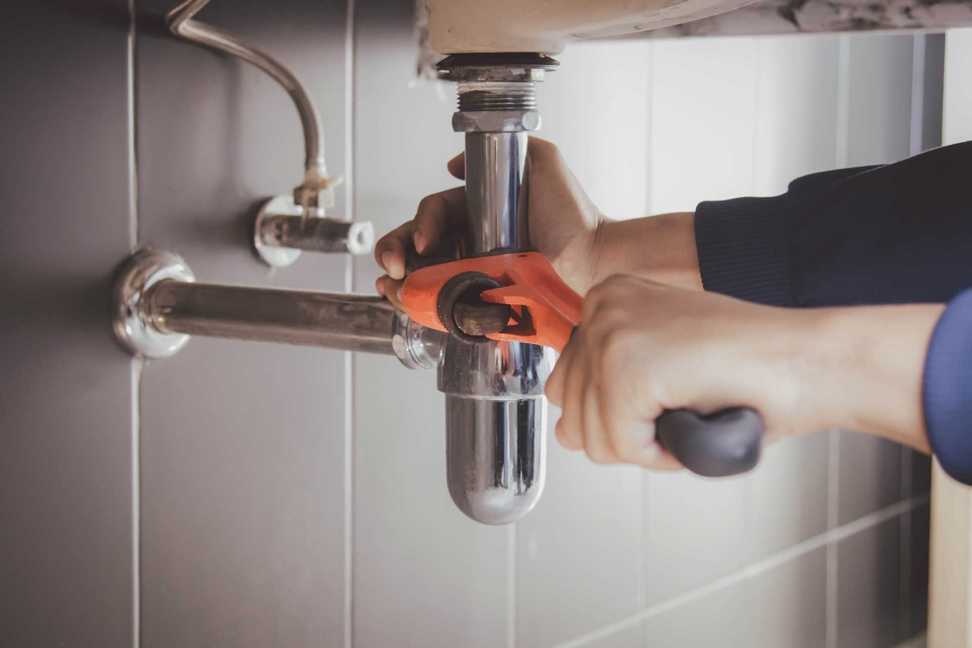 plumber at work in a bathroom
