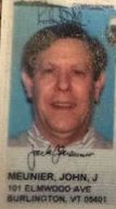 A close up of a man 's face on a id card