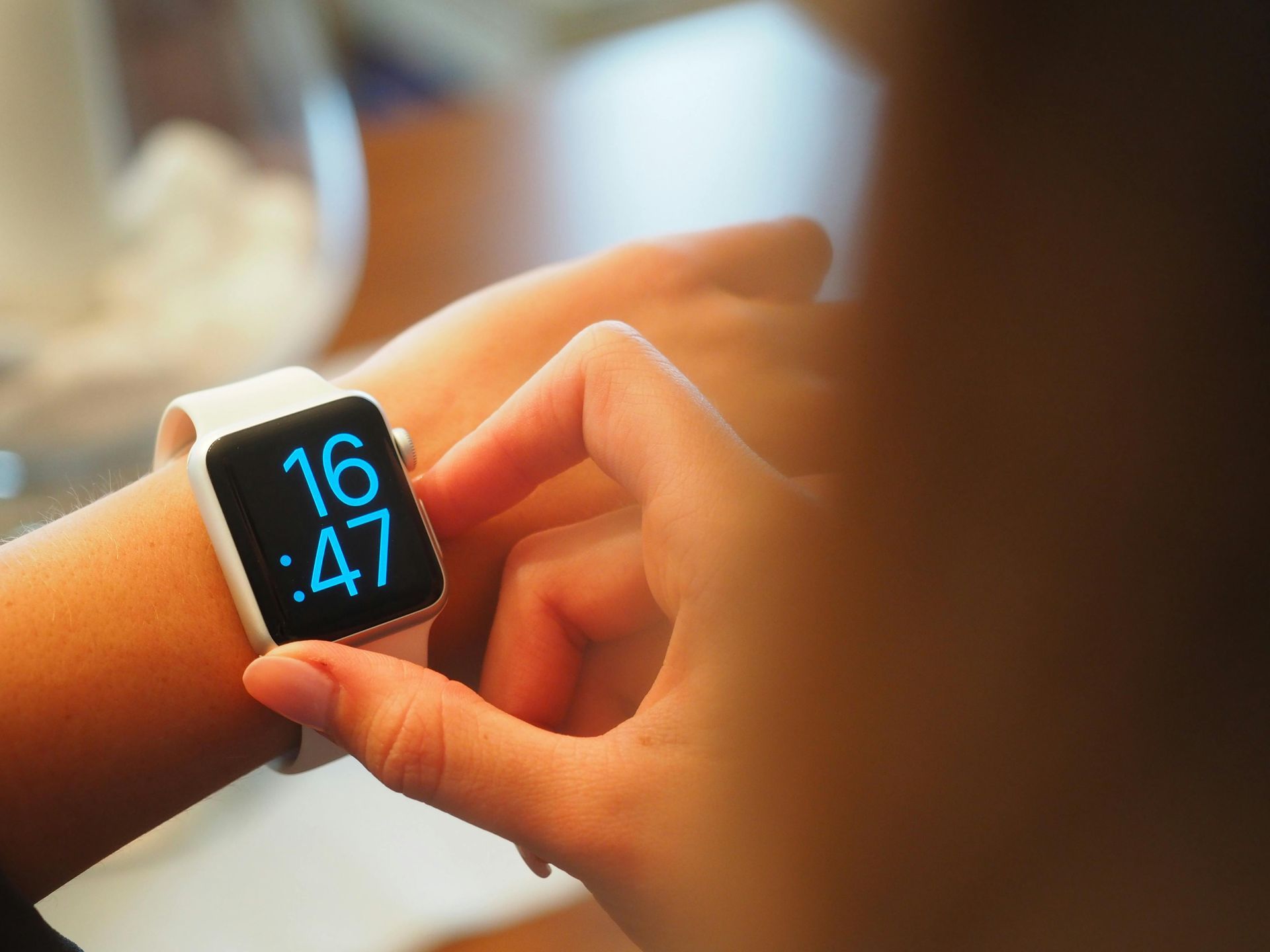 A person is wearing an apple watch on their wrist.