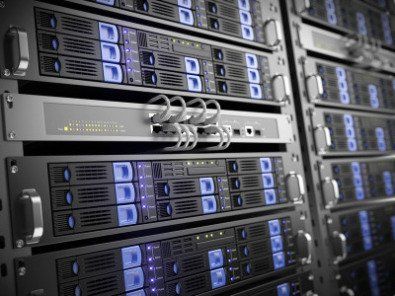 a bunch of servers are stacked on top of each other in a server room .