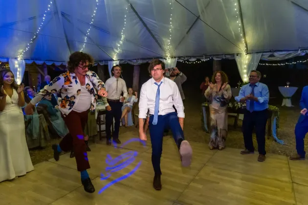 A flagstaff Arizona Wedding under a tent with joyus dancing.