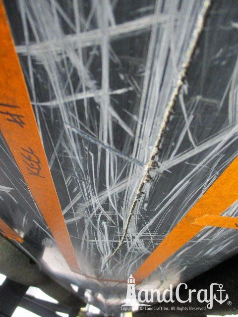 Skeeter boat with scratches and damage along the bottom hull