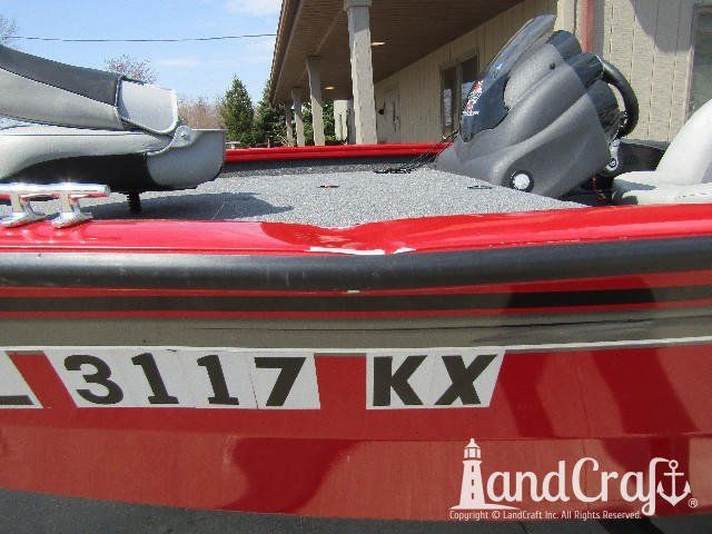 Aluminum Tracker boat with large side gunnel dent