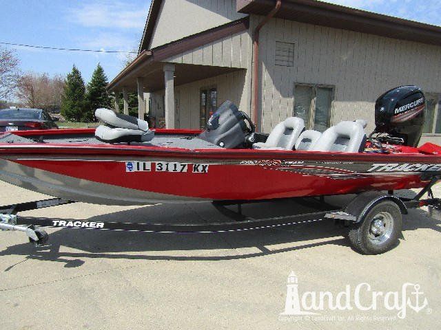 Aluminum Tracker boat with large side gunnel dent