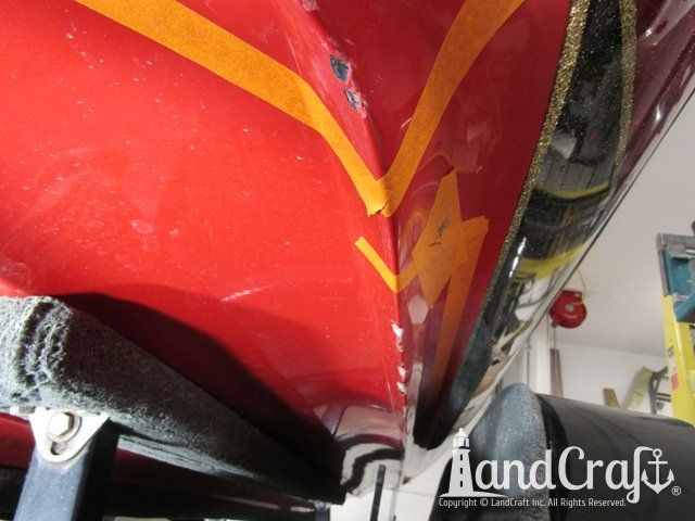 Stratos boat with scrapes and gouges